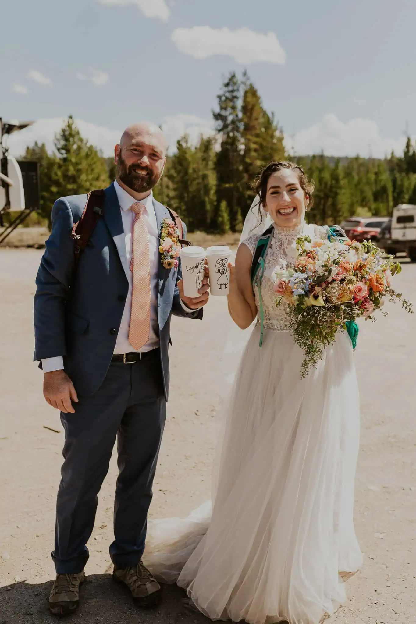eloping couple smiling with coffees