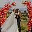 Tamarack Resort Idaho Micro-Wedding with pink floral arch and first kiss