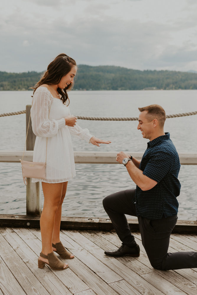 surprise proposal on the coeur d'alene resort boardwalk in north idaho, karlie larson photography