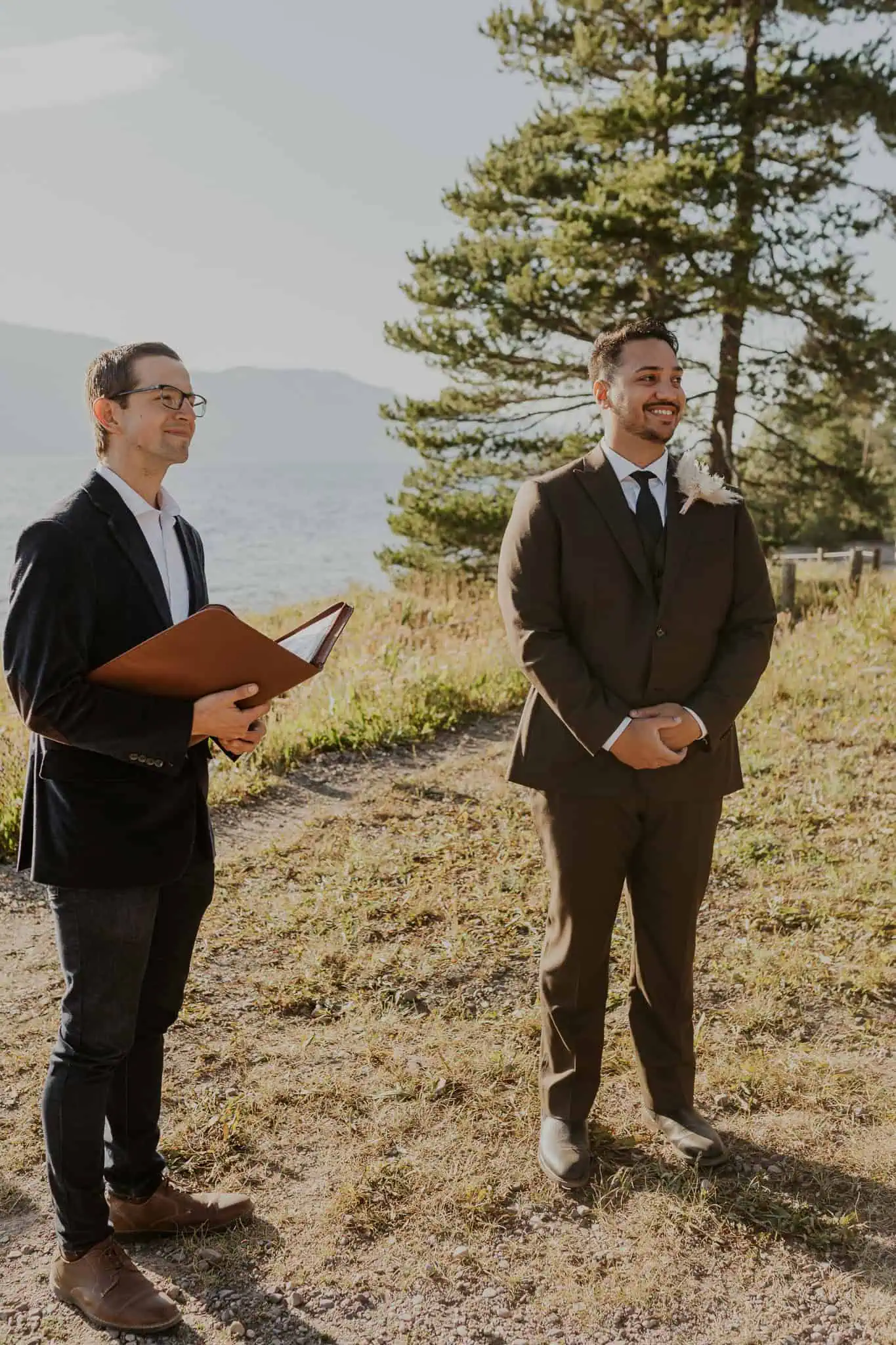a groom smiling at his bride during ceremony