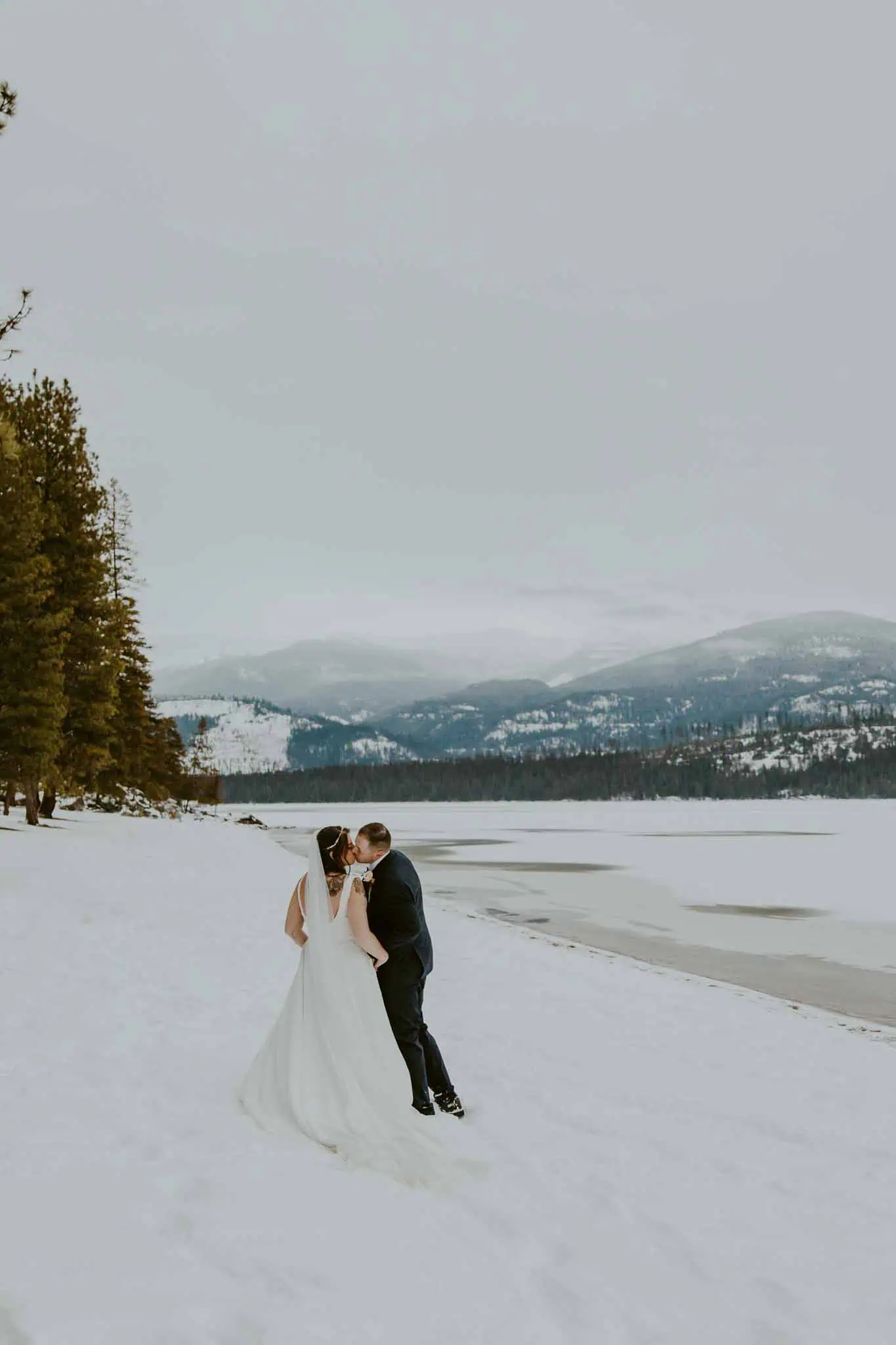 winter bridal portraits by a lake