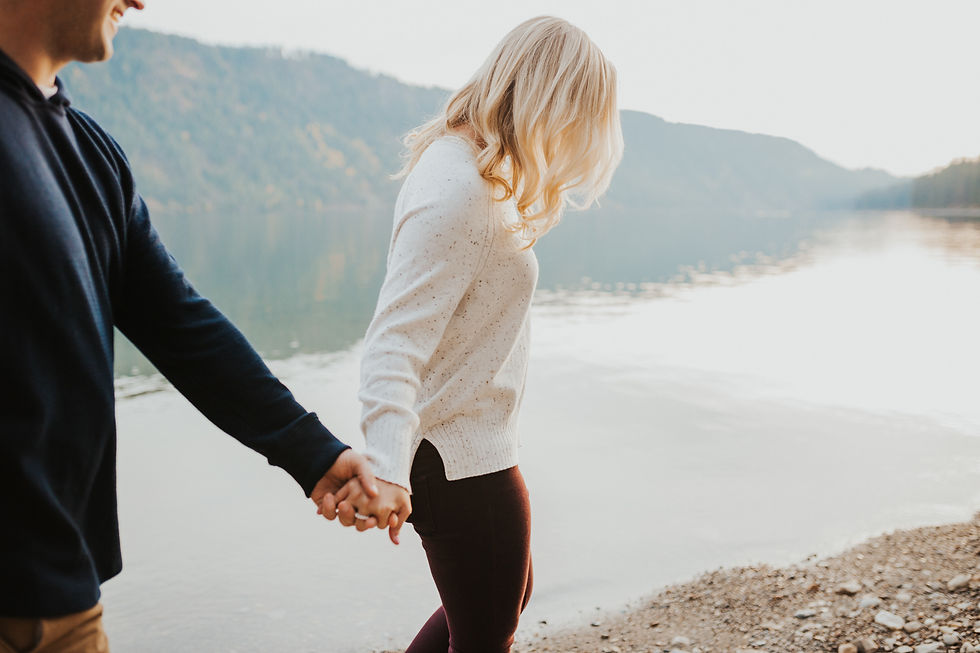 engagement session in north idaho with mountains, fields, and lake