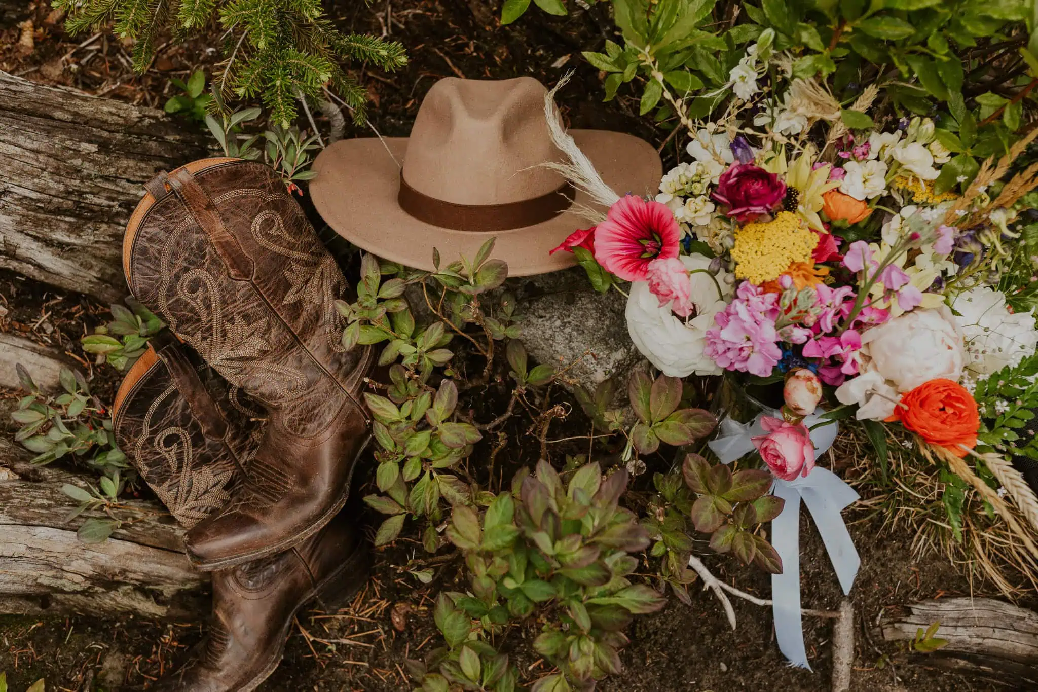 elopement details with flowers, hat and boots