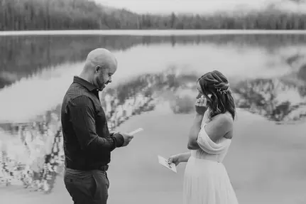 bride wiping tears when reading vows