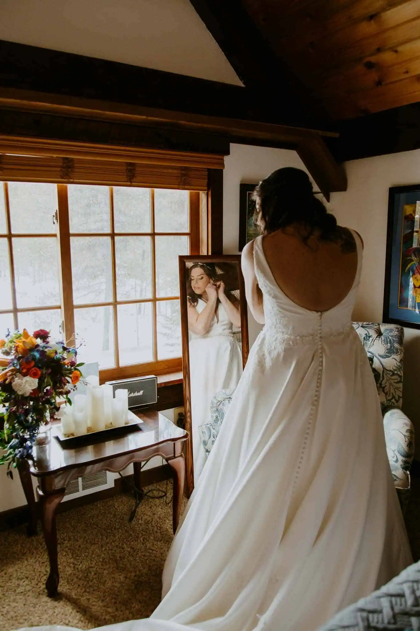 a bride getting ready with a full length mirror