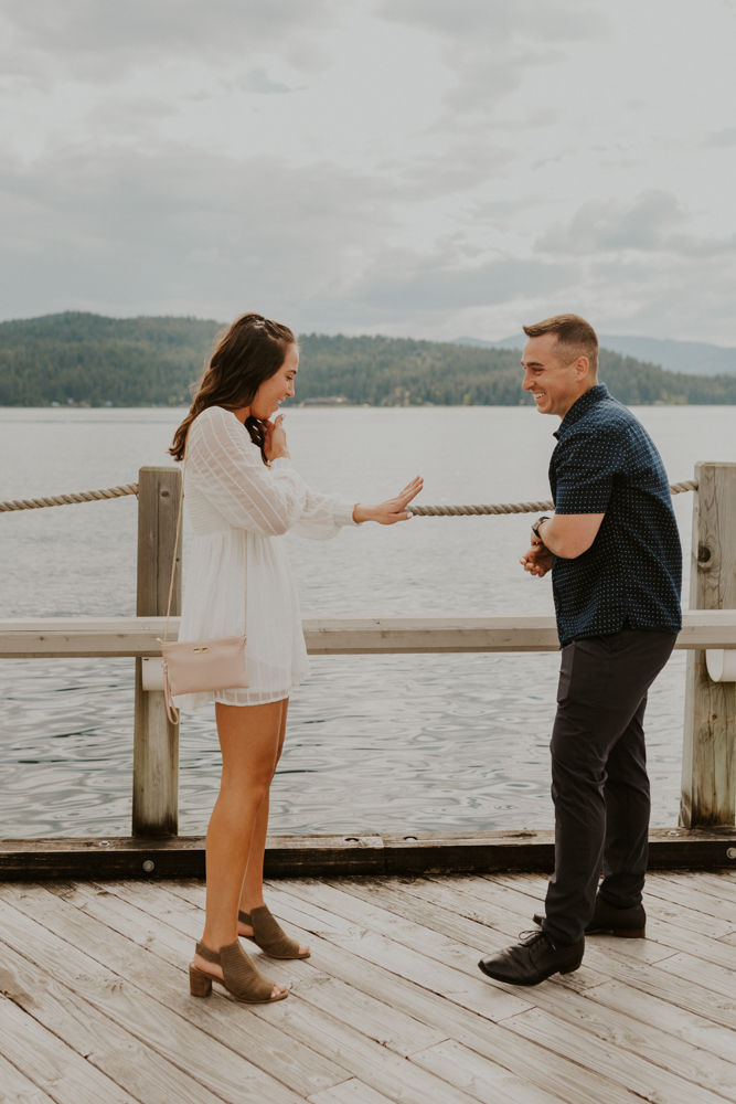 surprise proposal on the coeur d'alene resort boardwalk in north idaho, karlie larson photography