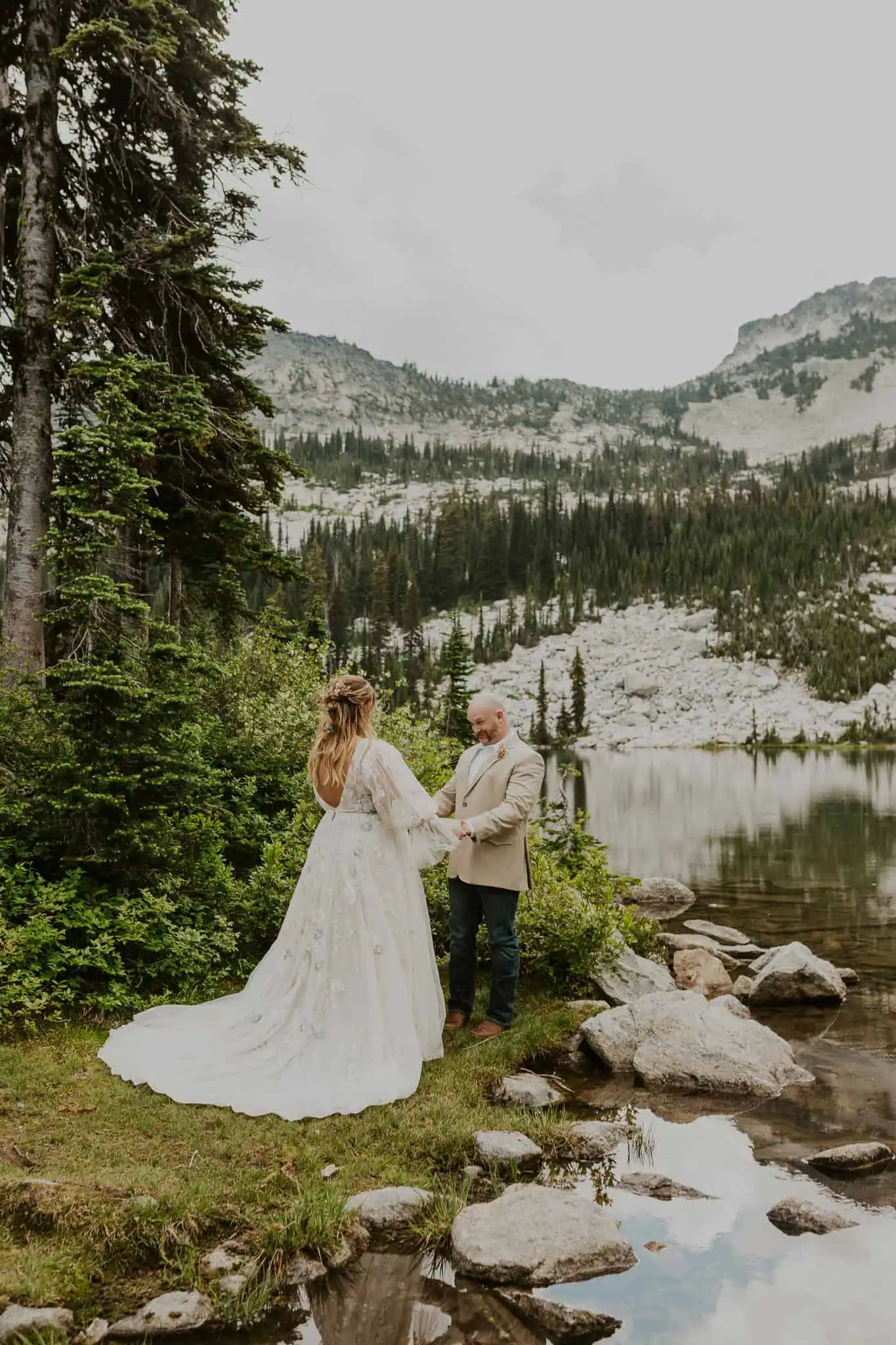 bride and groom first look in the mountains