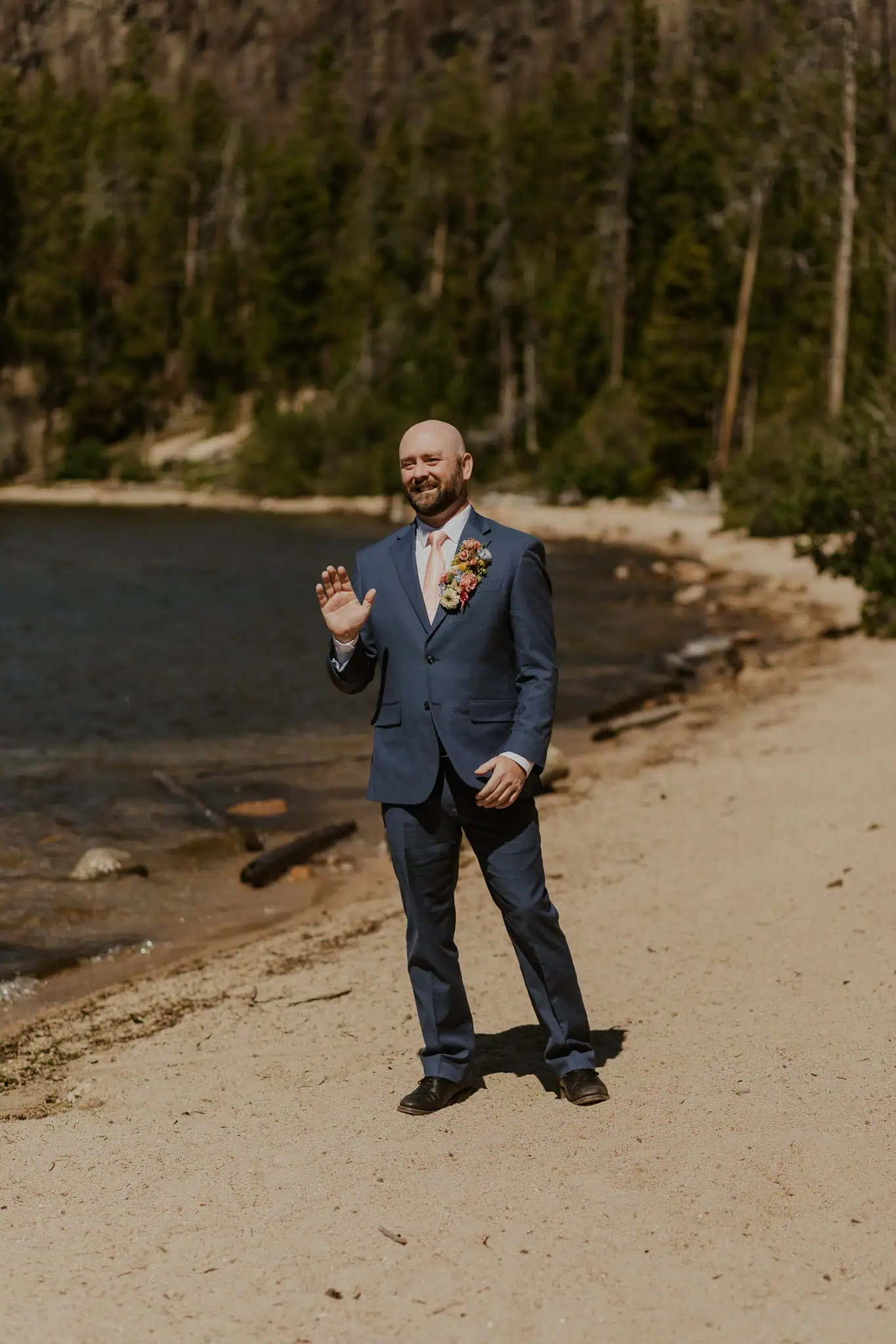 groom waving to his bride
