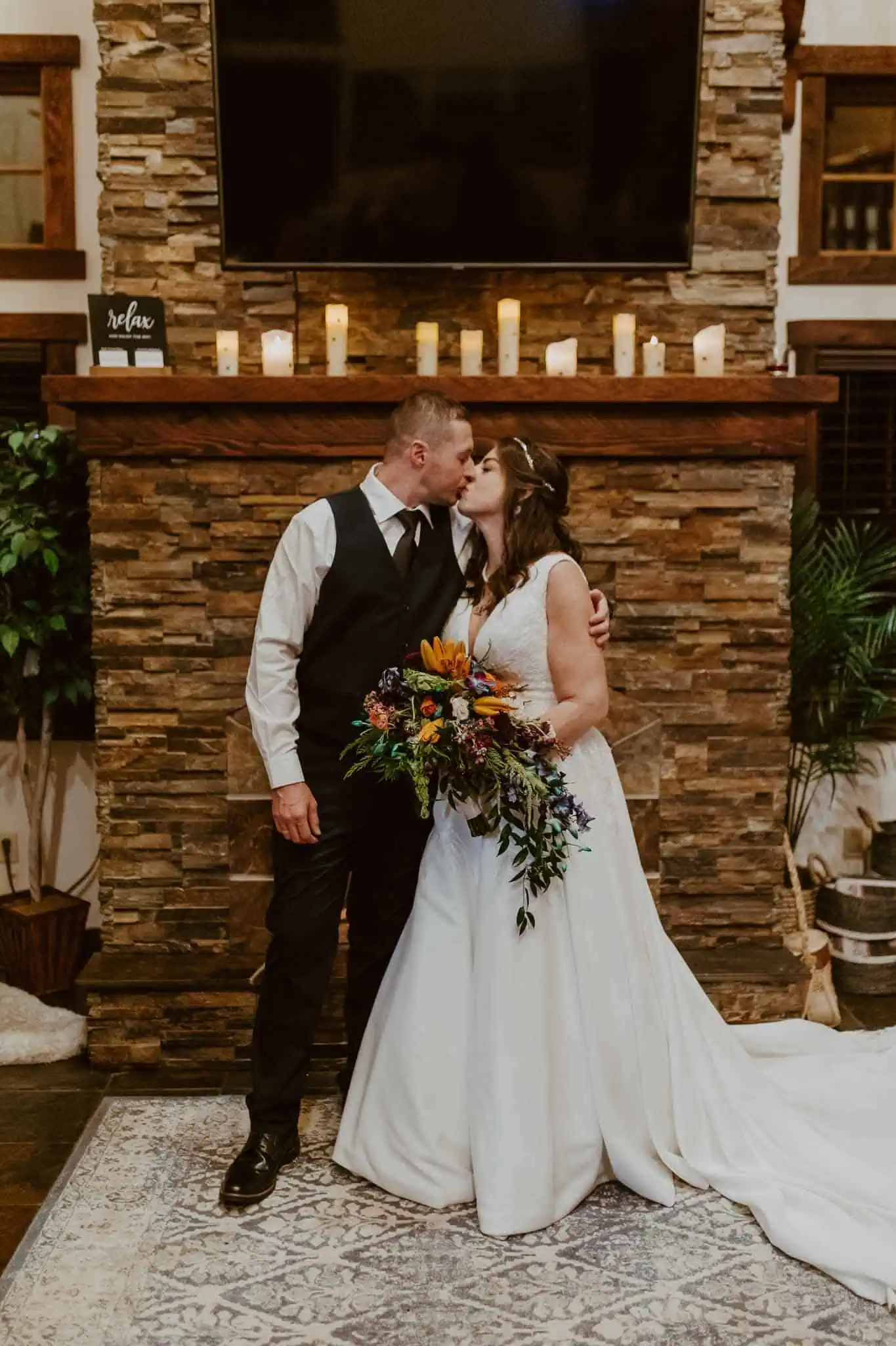 couples portraits in front of fireplace