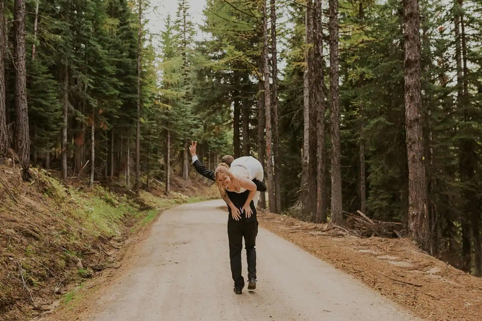 groom carrying bride away