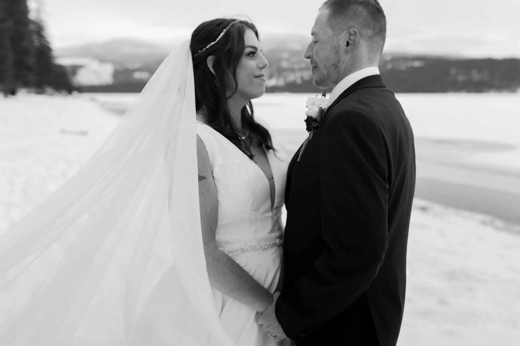 winter bridal portraits by a lake
