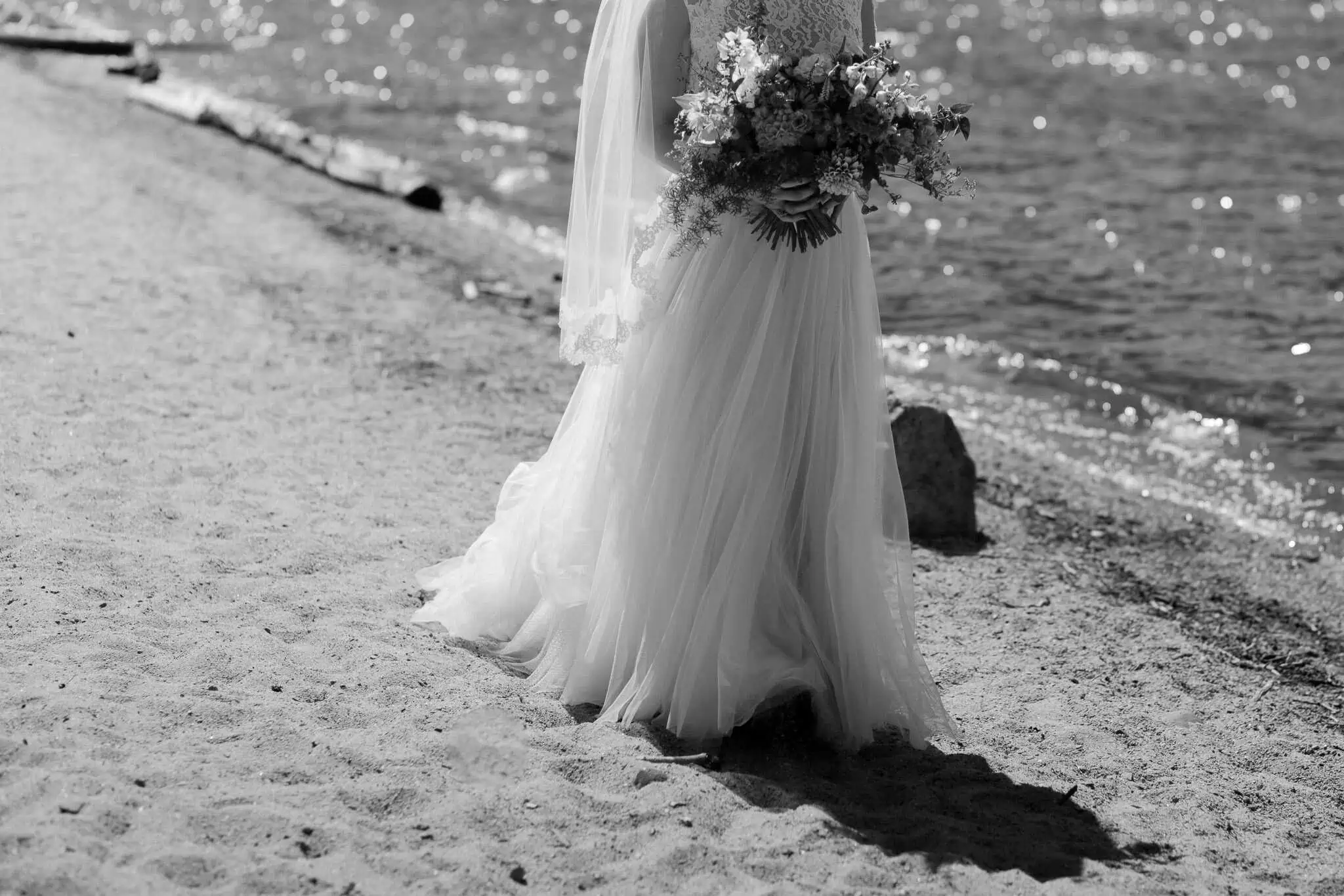 bride walking on a sandy beach