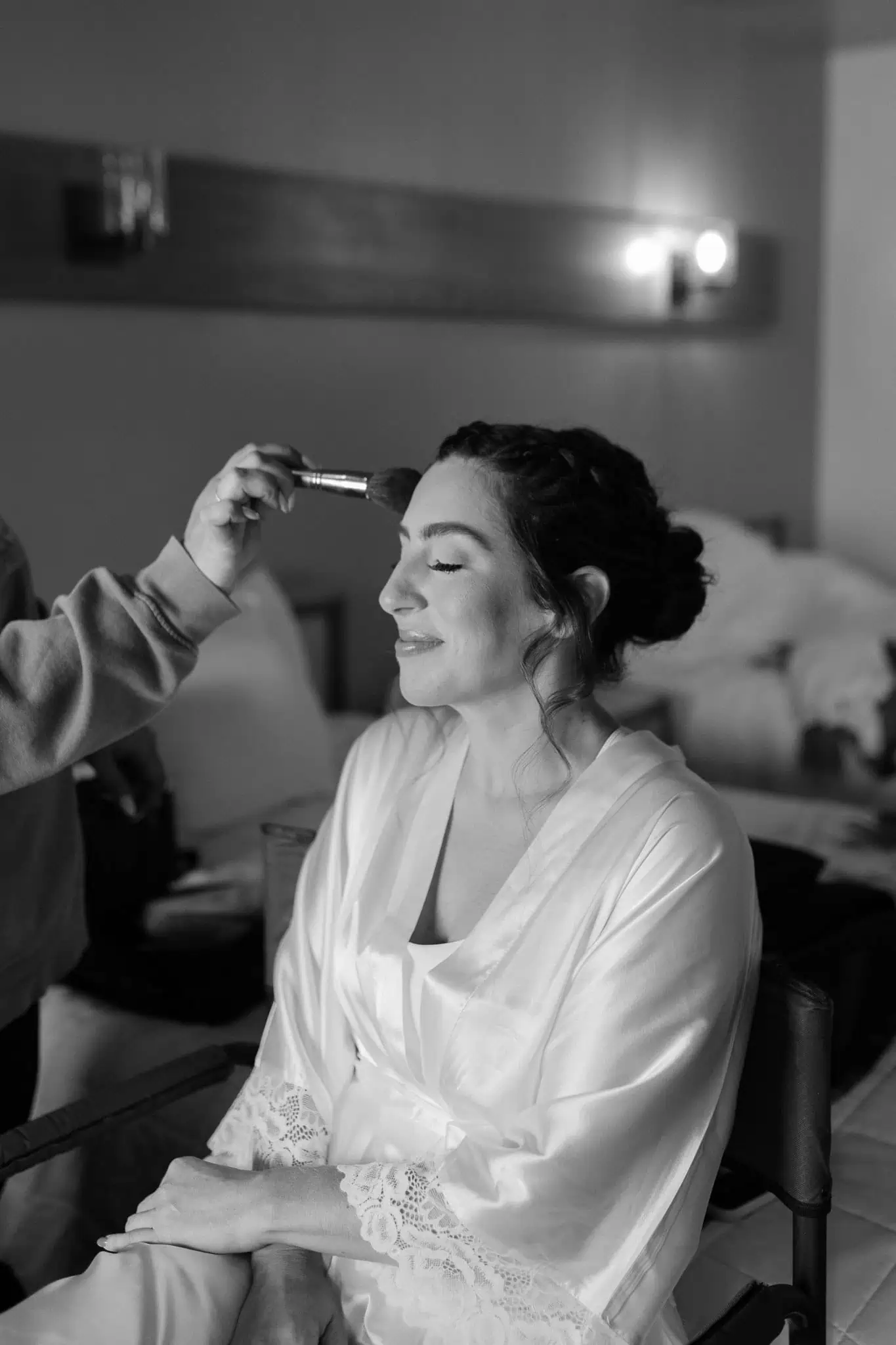 bride getting makeup done 