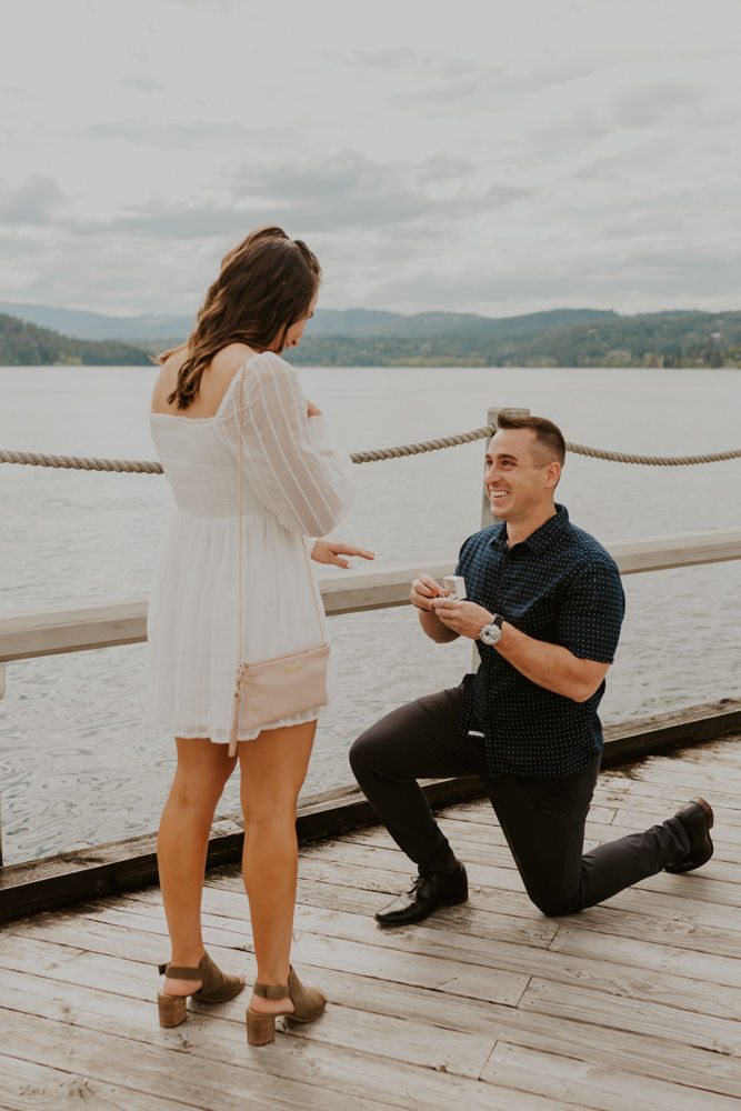 surprise proposal on the coeur d'alene resort boardwalk in north idaho, karlie larson photography