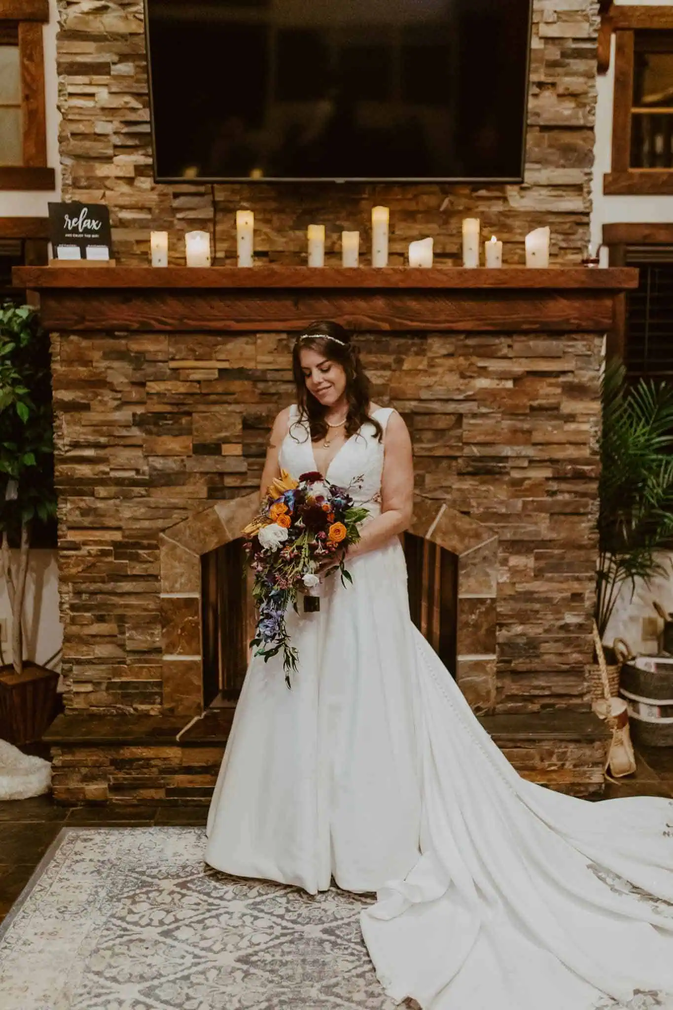 couples portraits in front of fireplace