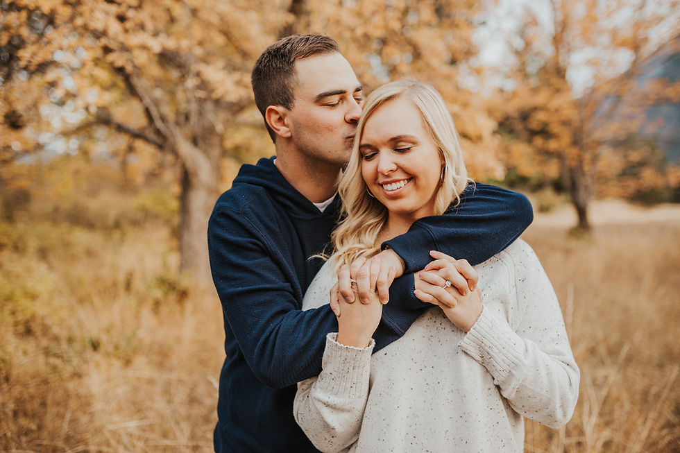 engagement session in north idaho with mountains, fields, and lake