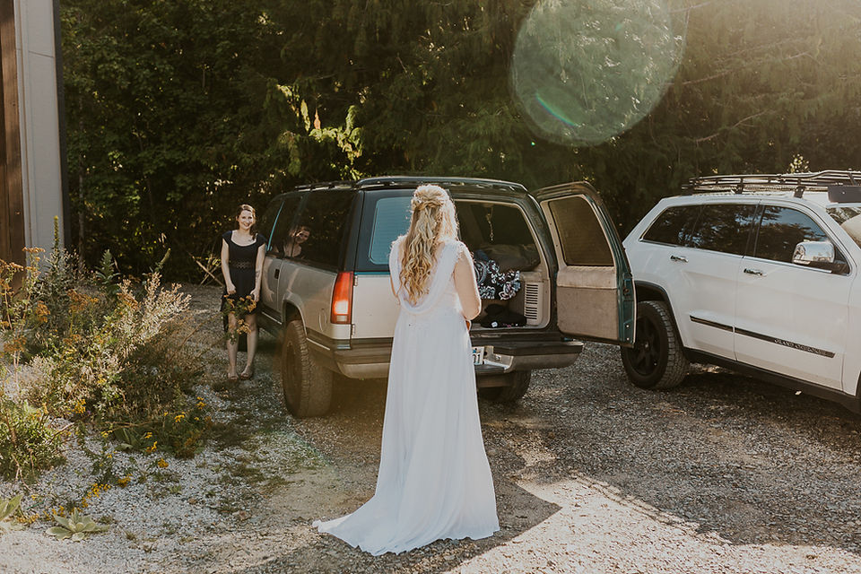 the bride and her friends getting in the car to drive to the trailhead