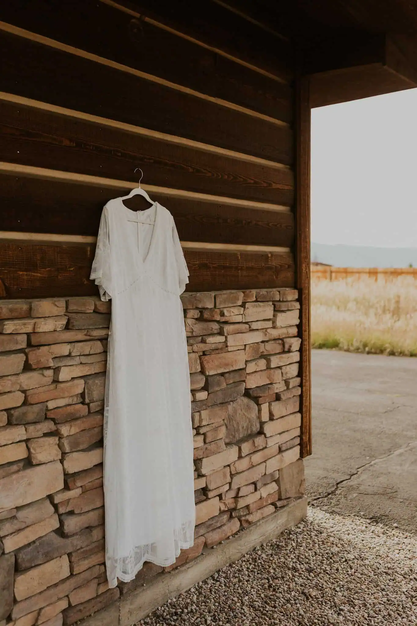 wedding dress hanging on a cabin