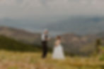 an eloping couple reading vows on a mountain in north idaho