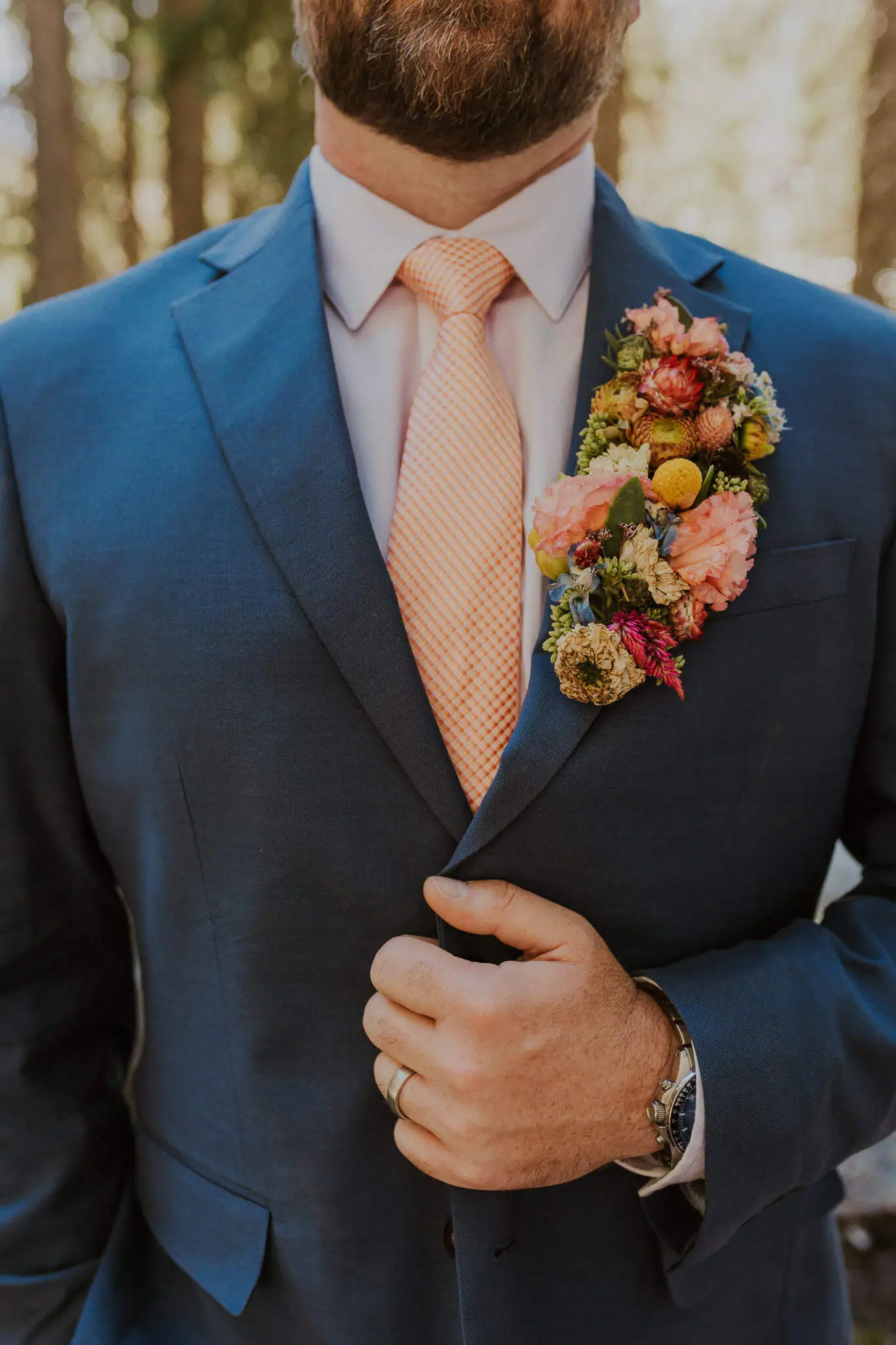 groom floral lapel
