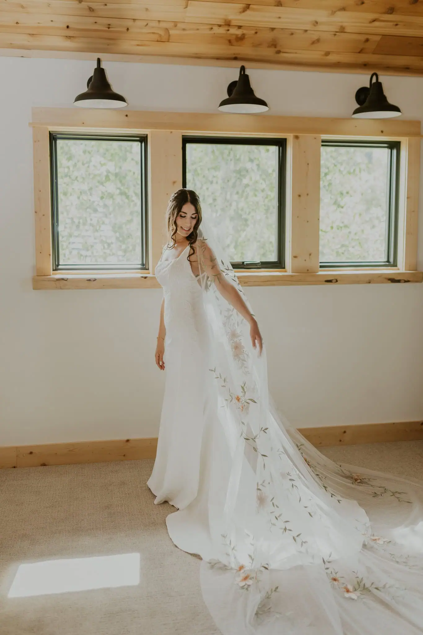 bride wearing a wedding dress and long veil