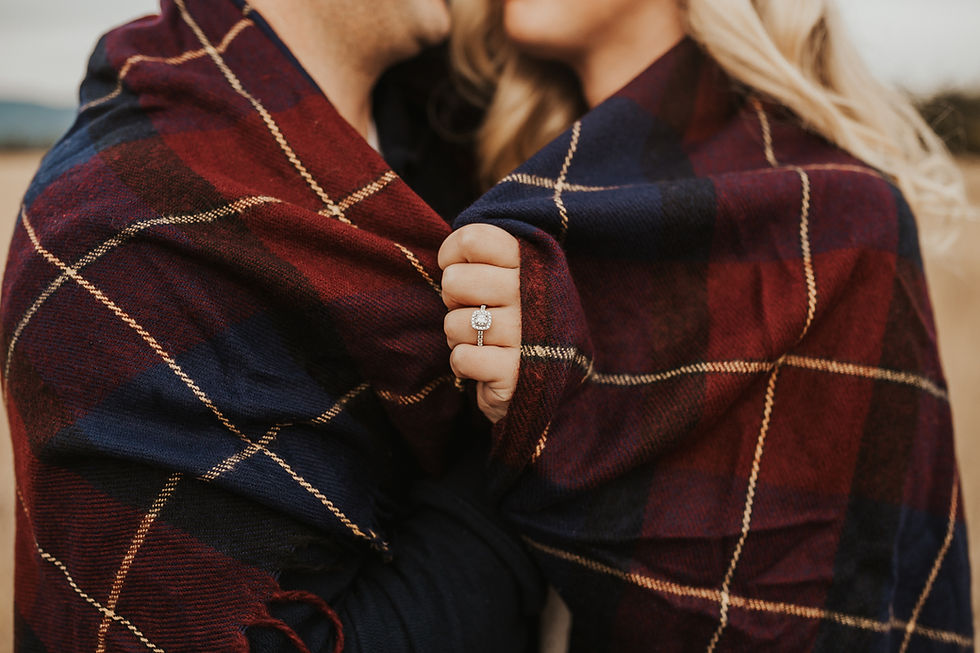 engagement session in north idaho with mountains, fields, and lake