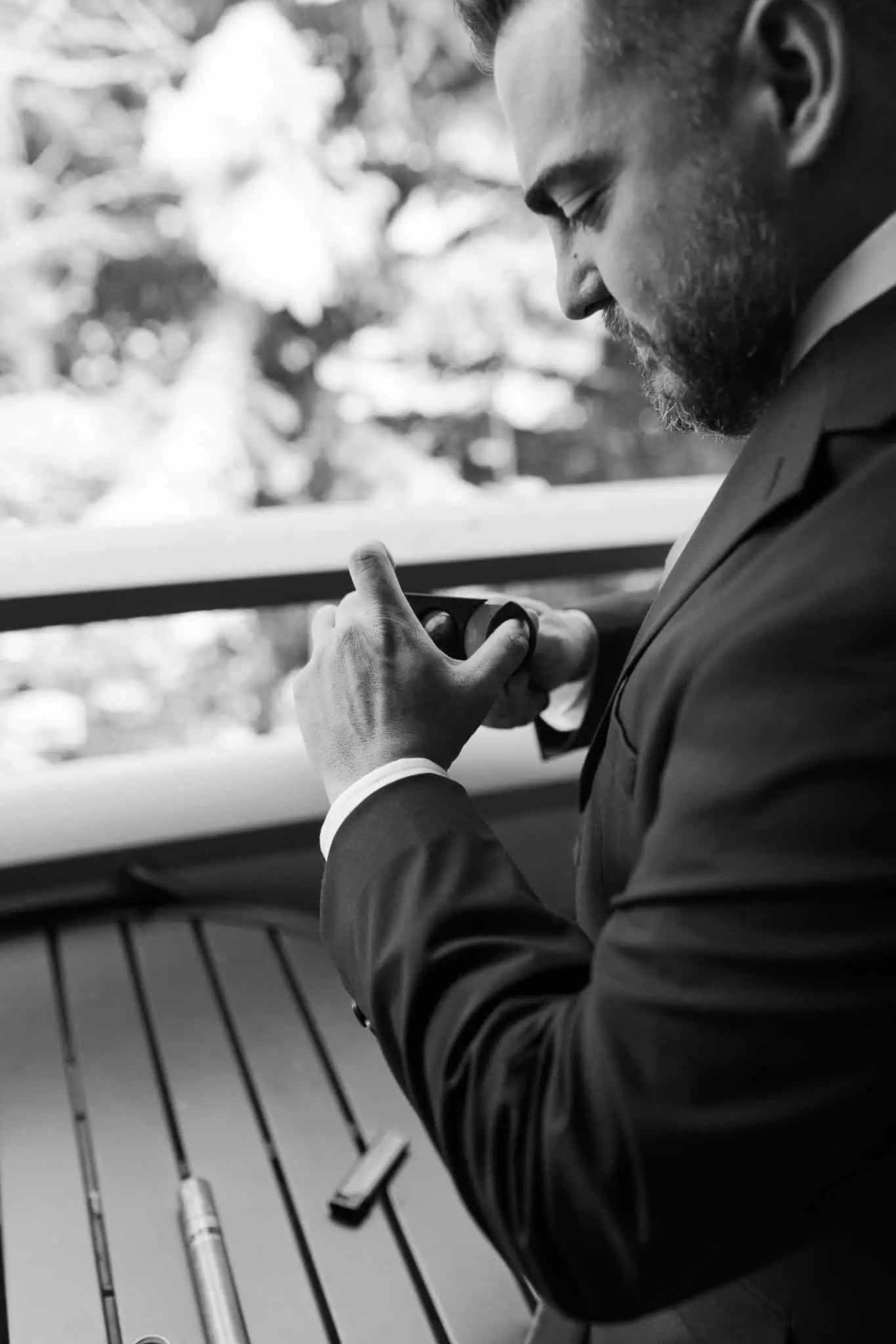 a groom cutting his cigar
