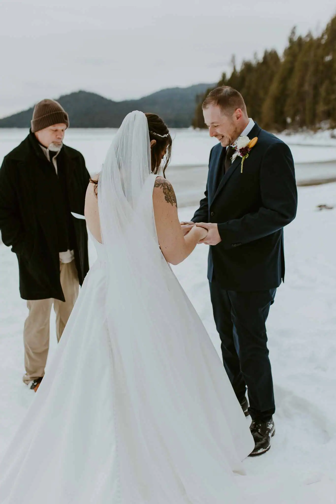 winter elopement ceremony on a beach