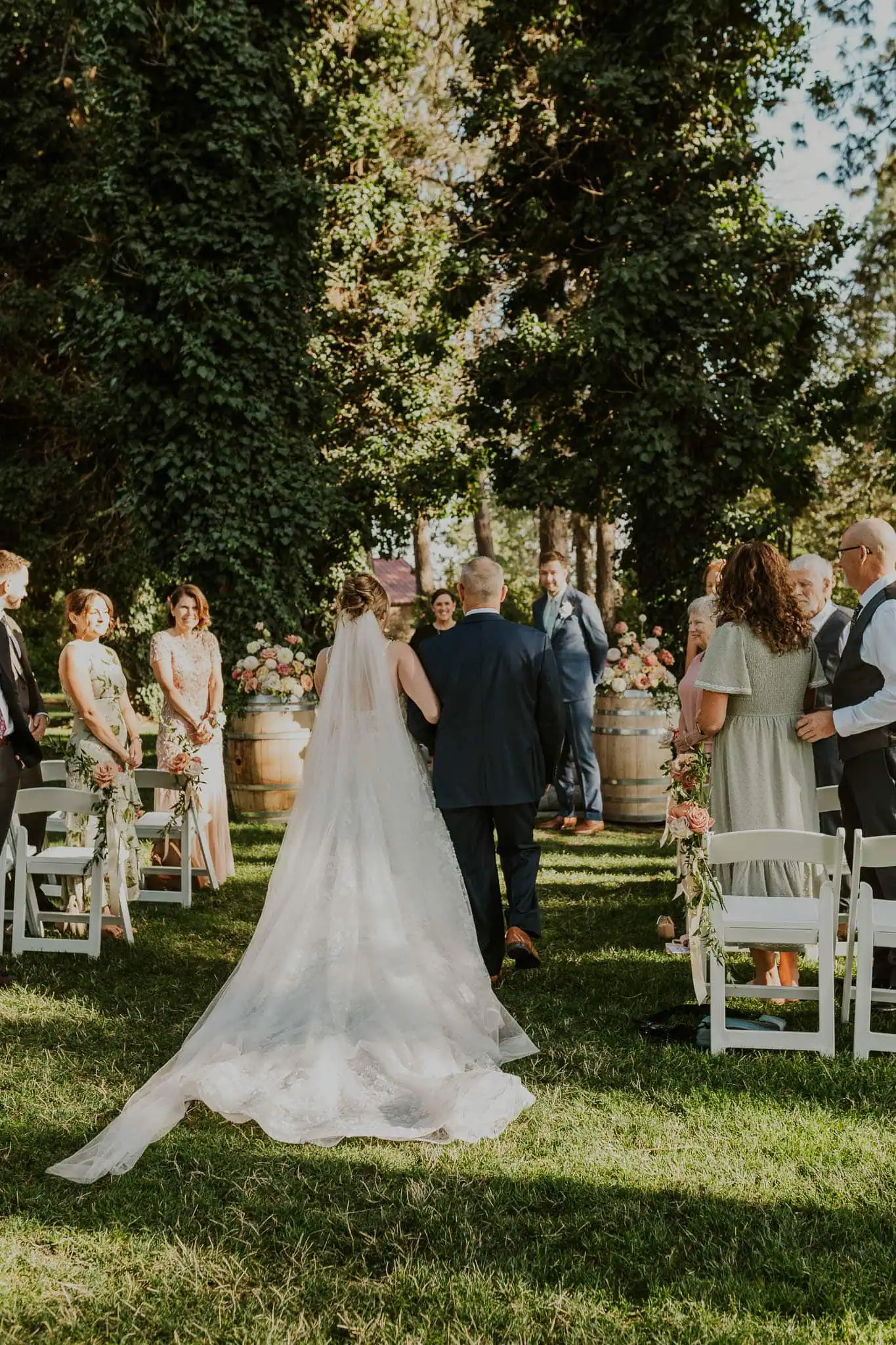 brides dad walking her down the aisle at arbor crest winery
