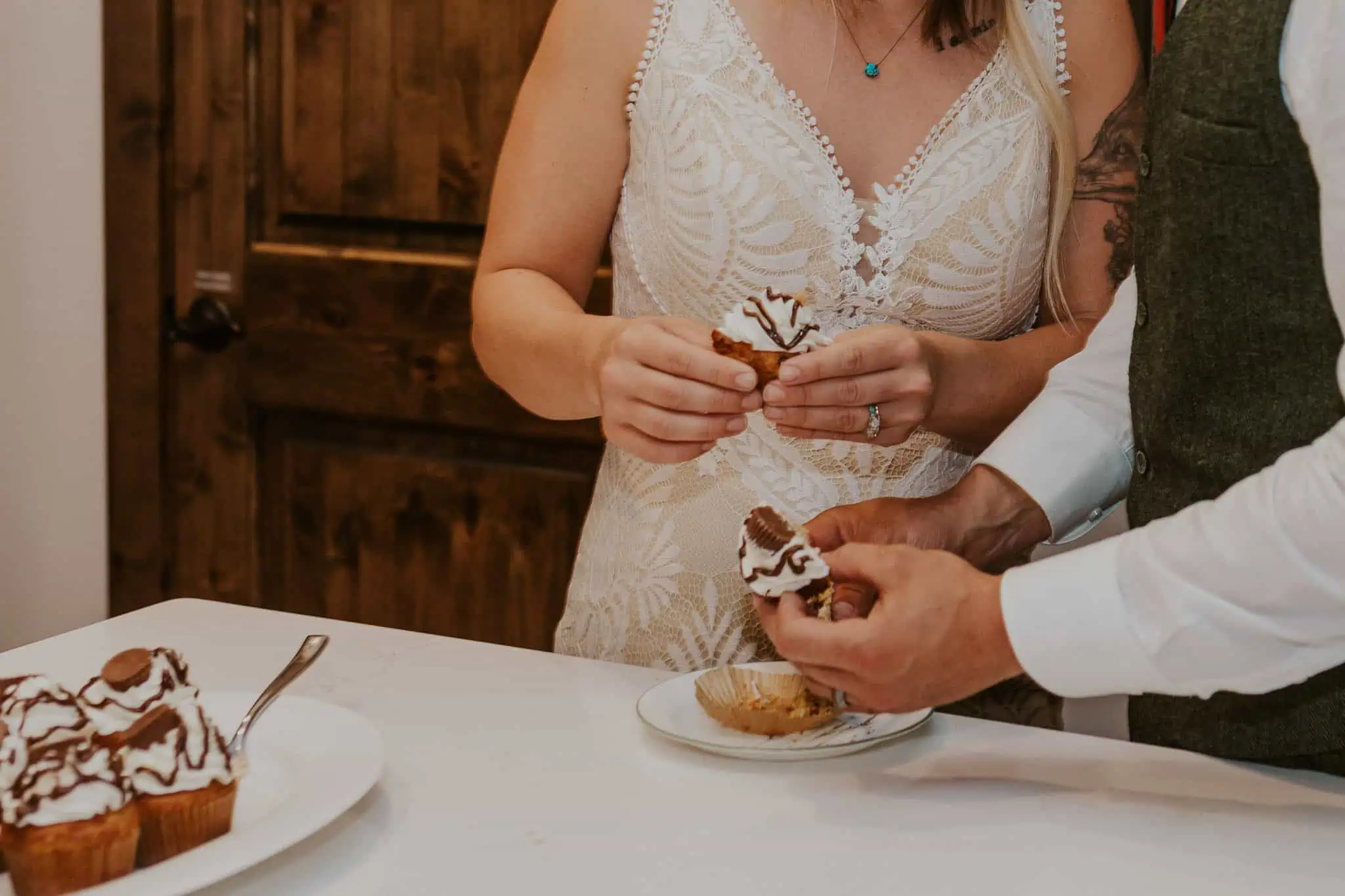 a couple eating cupcakes for dessert