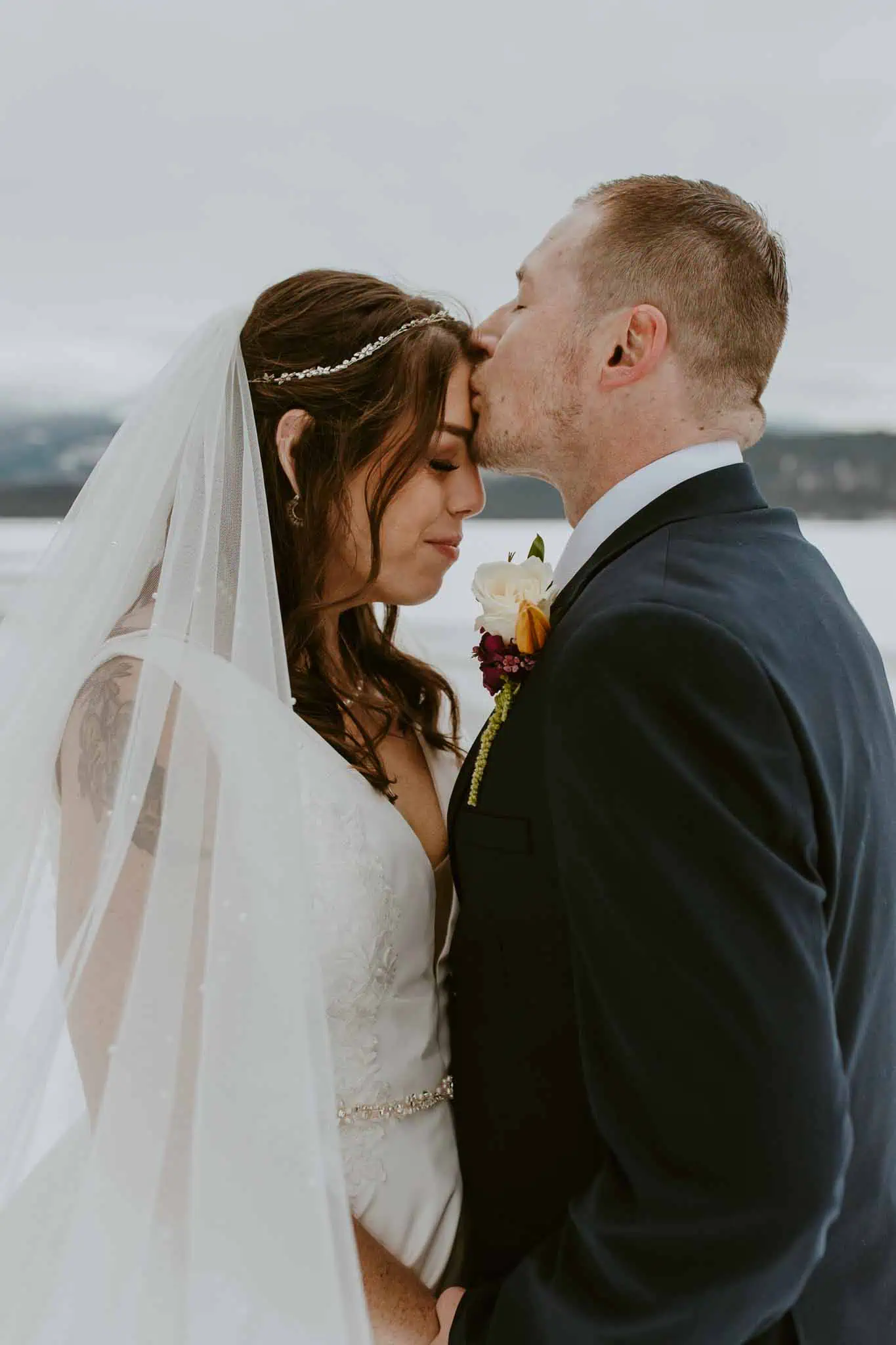 winter bridal portraits by a lake