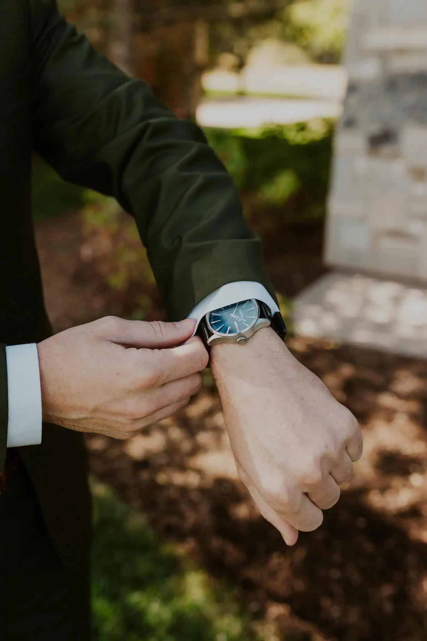 groom holding a watch