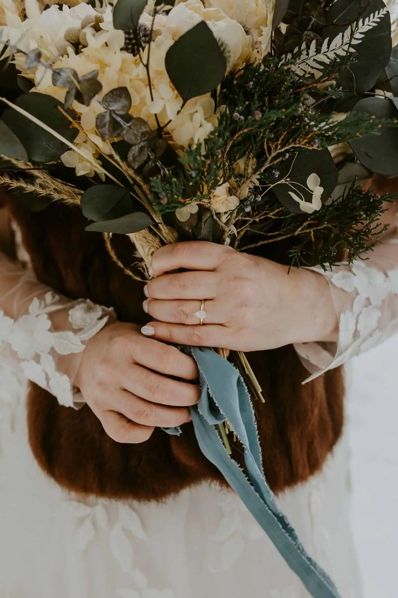 a bride holding her flower bouquet