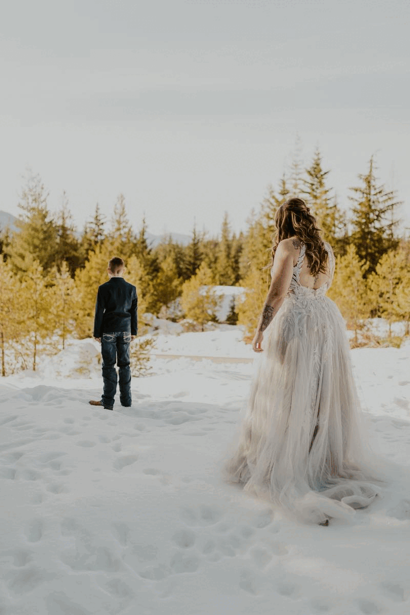 bride's first look with son in the snow gif