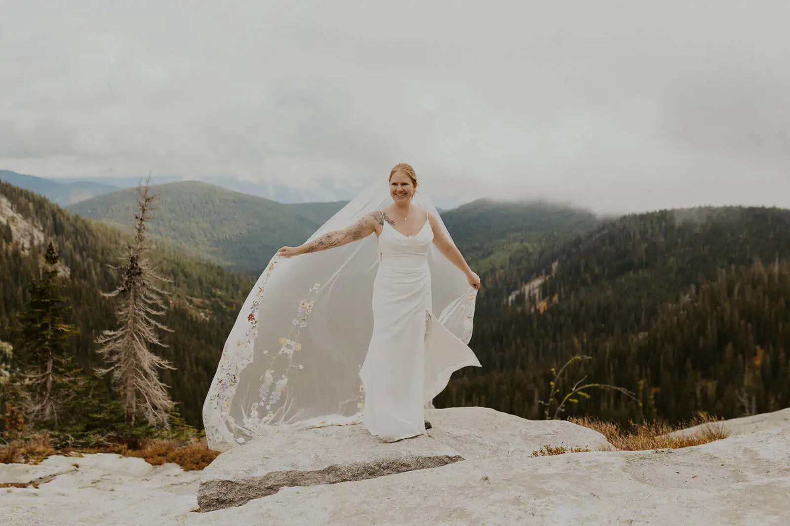 bride with long veil blowing in the wind