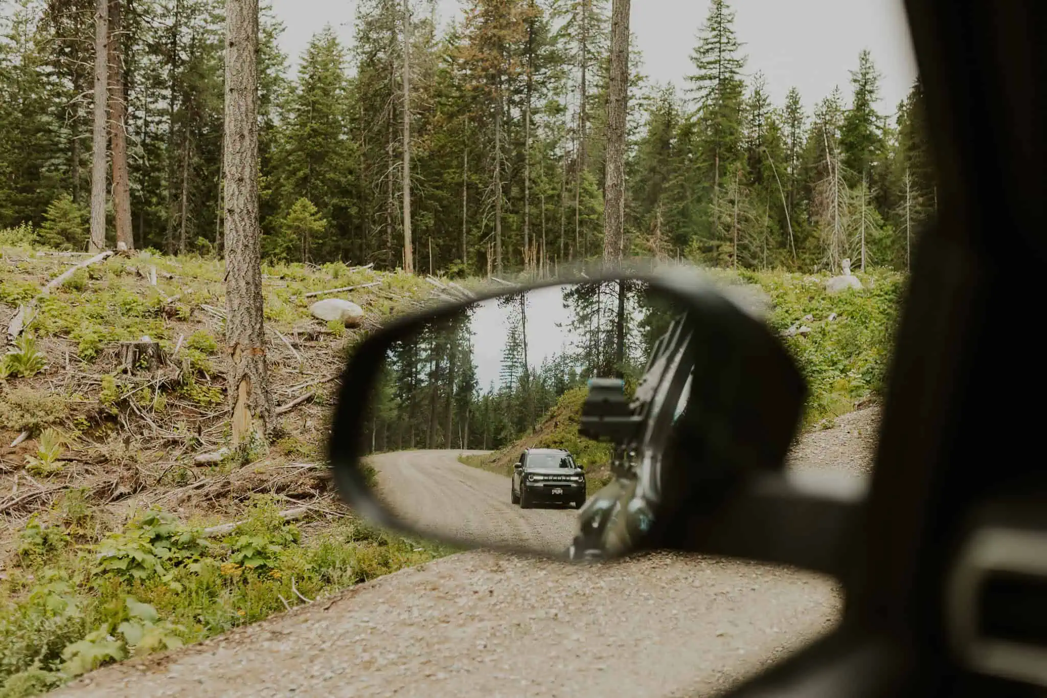 a car reflection in a side view mirror