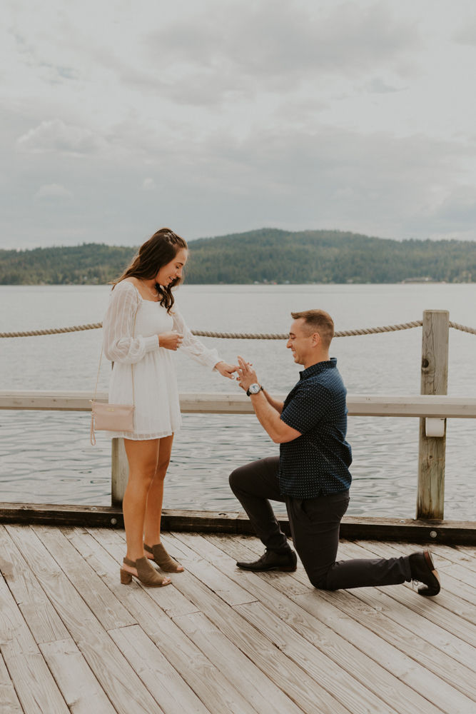 surprise proposal on the coeur d'alene resort boardwalk in north idaho, karlie larson photography