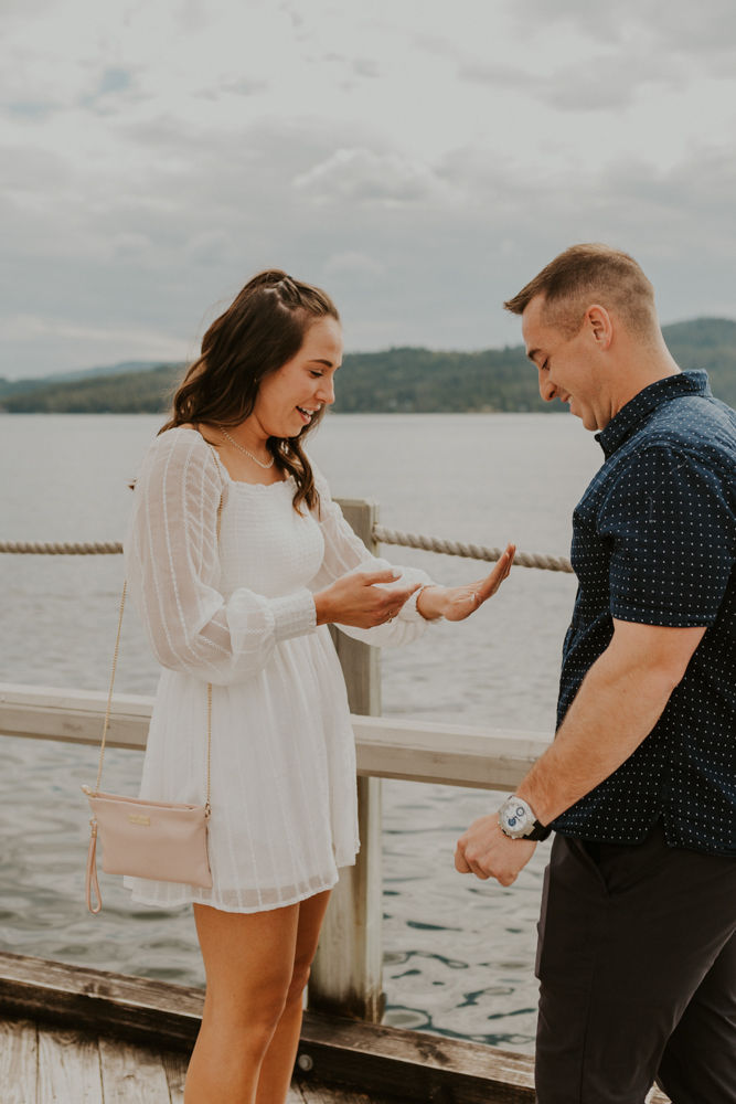 surprise proposal on the coeur d'alene resort boardwalk in north idaho, karlie larson photography