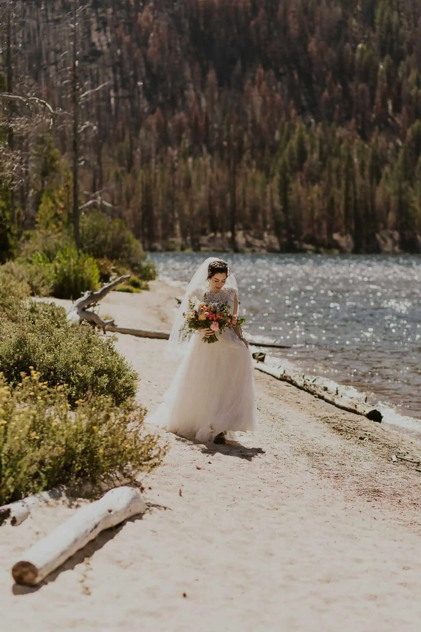 bride walking on a sandy beach