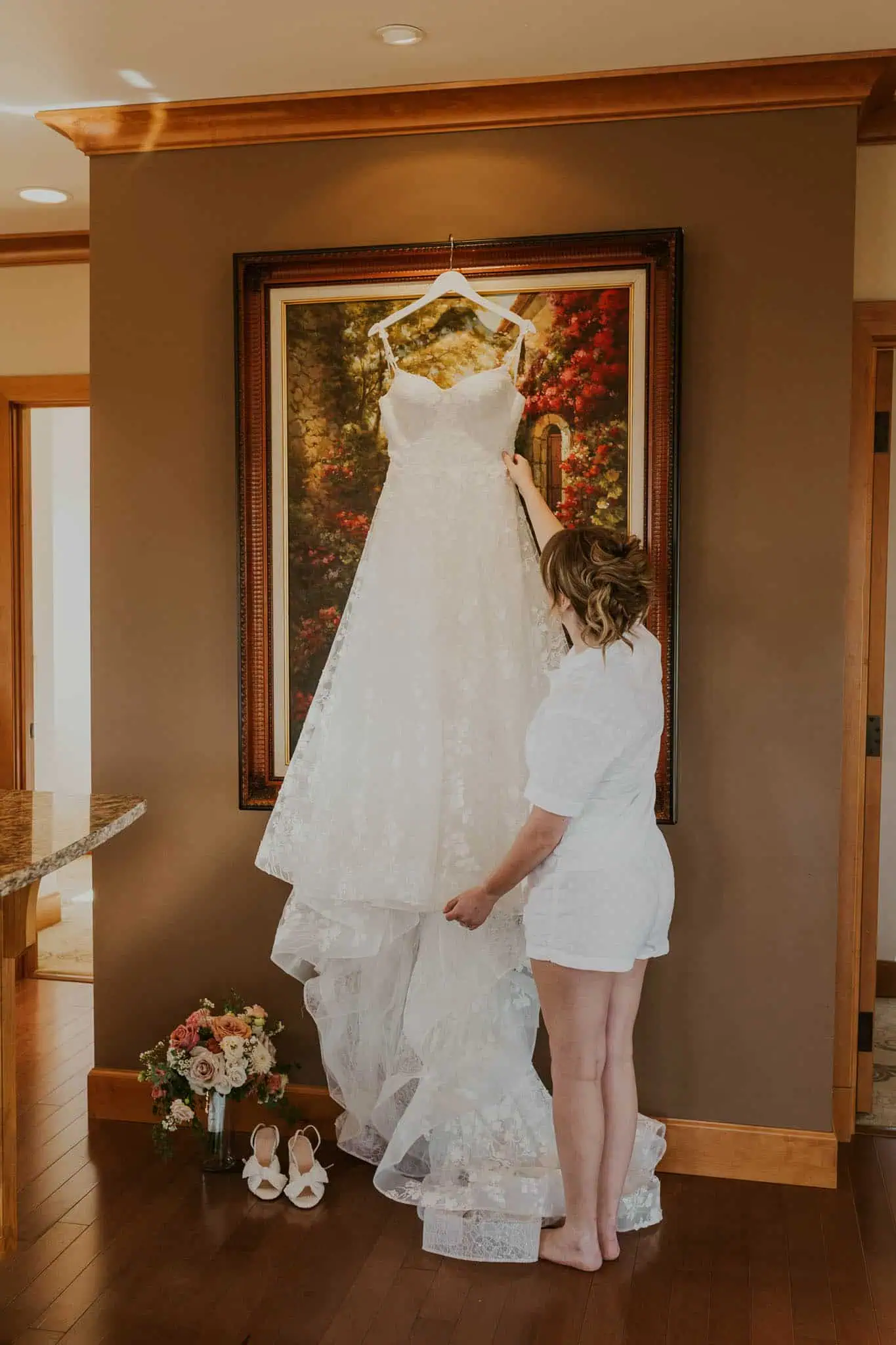 bride looking at her wedding dress