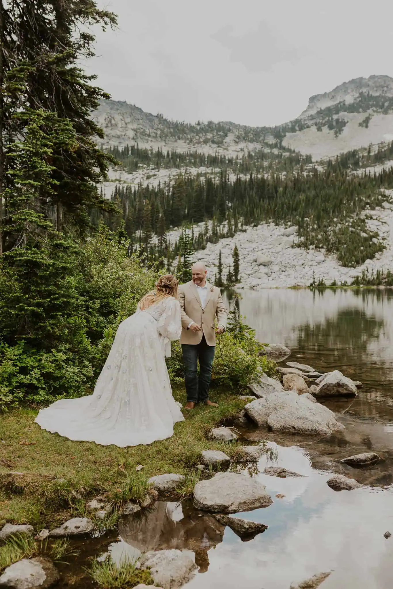 bride and groom first look in the mountains