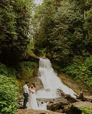 an elopement ceremony by a waterfall in the north cascades