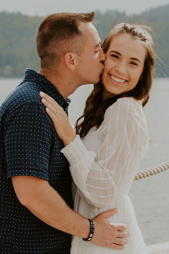 surprise proposal on the coeur d'alene resort boardwalk in north idaho, karlie larson photography