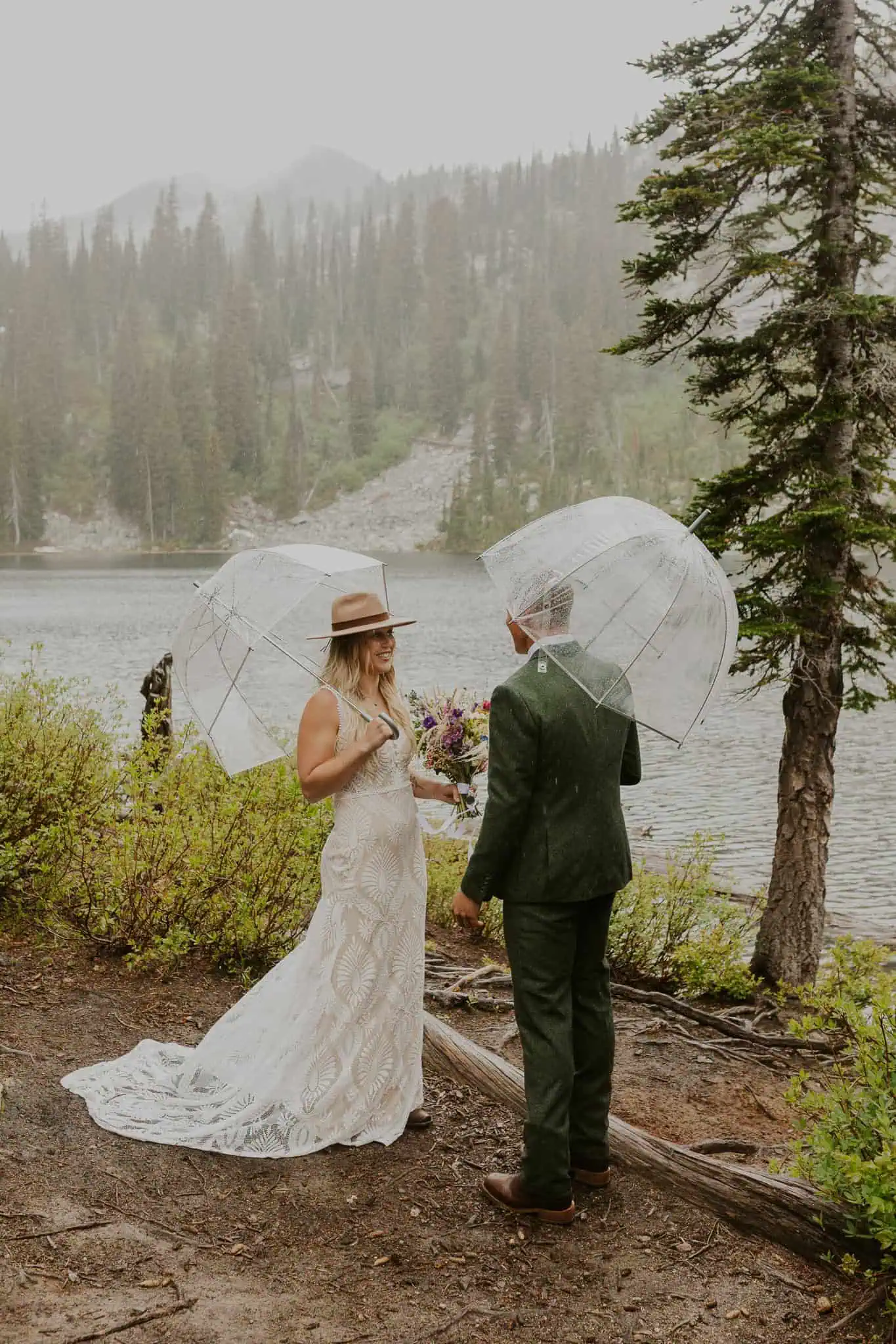 a couple sharing a first look in the rain