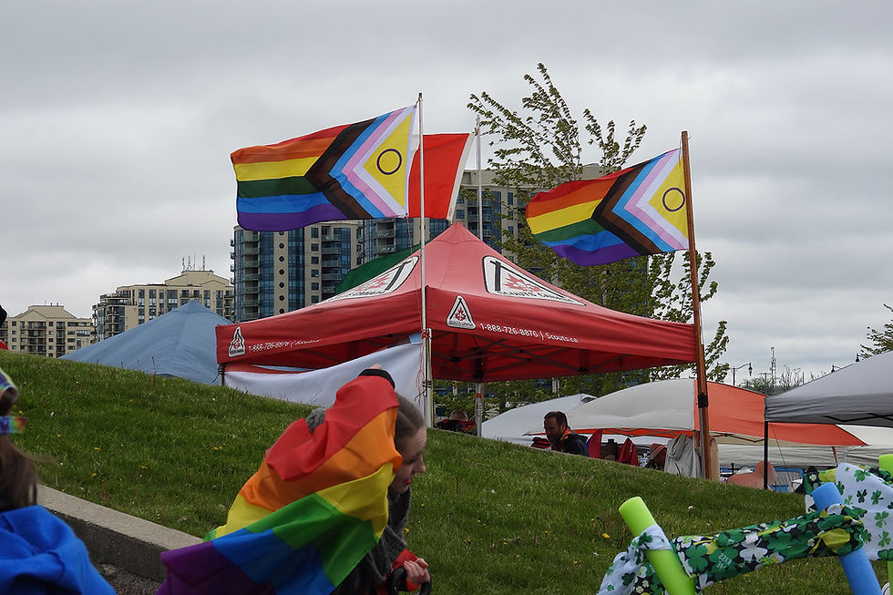 The Scouts Canada booth at Pride 2025, Progressive Pride flags flying proudly!