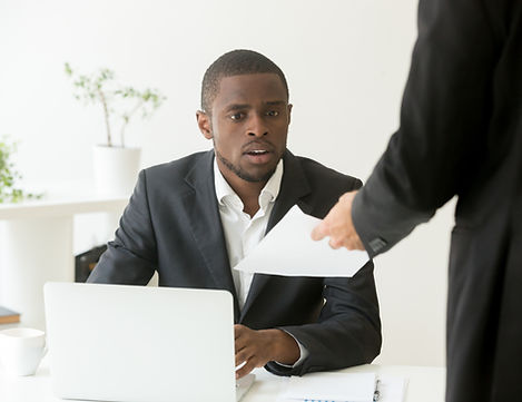 surprised-shocked-african-businessman-getting-unexpected-notice-from-caucasian-colleague.j