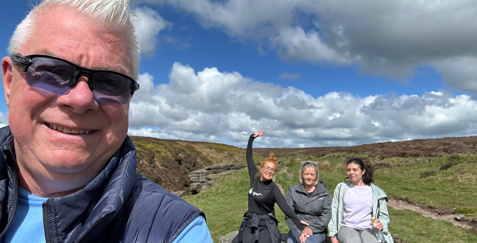 Noah's Ark Walking Group selfie, a man in front with three women with hands in the air