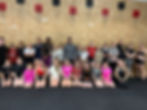 group photo of girls with coaches