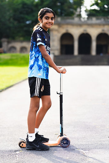 child on scooter