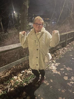 Woman in a coat out on a walk